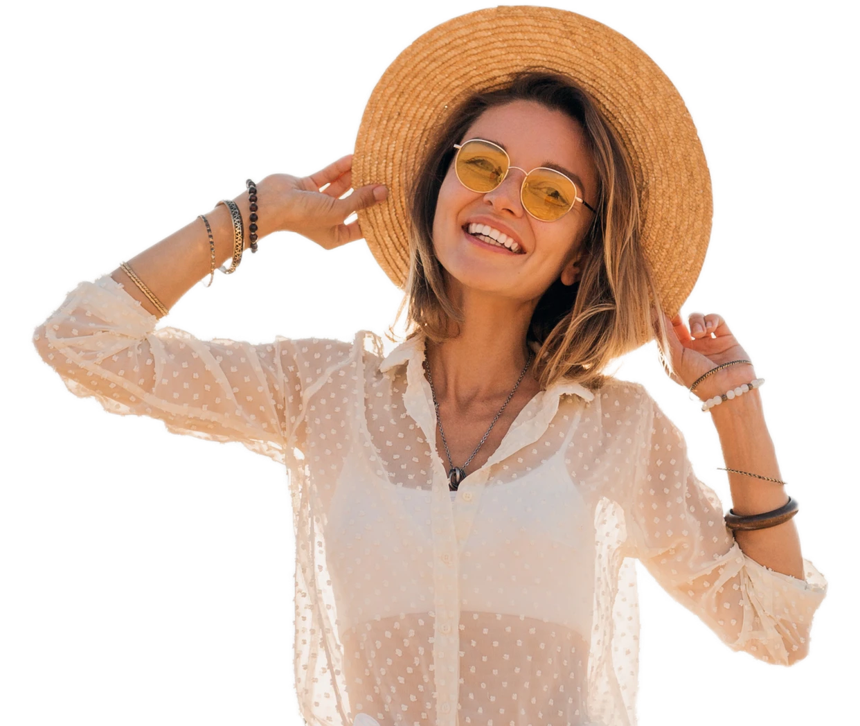 Smiling woman in a straw hat waving
